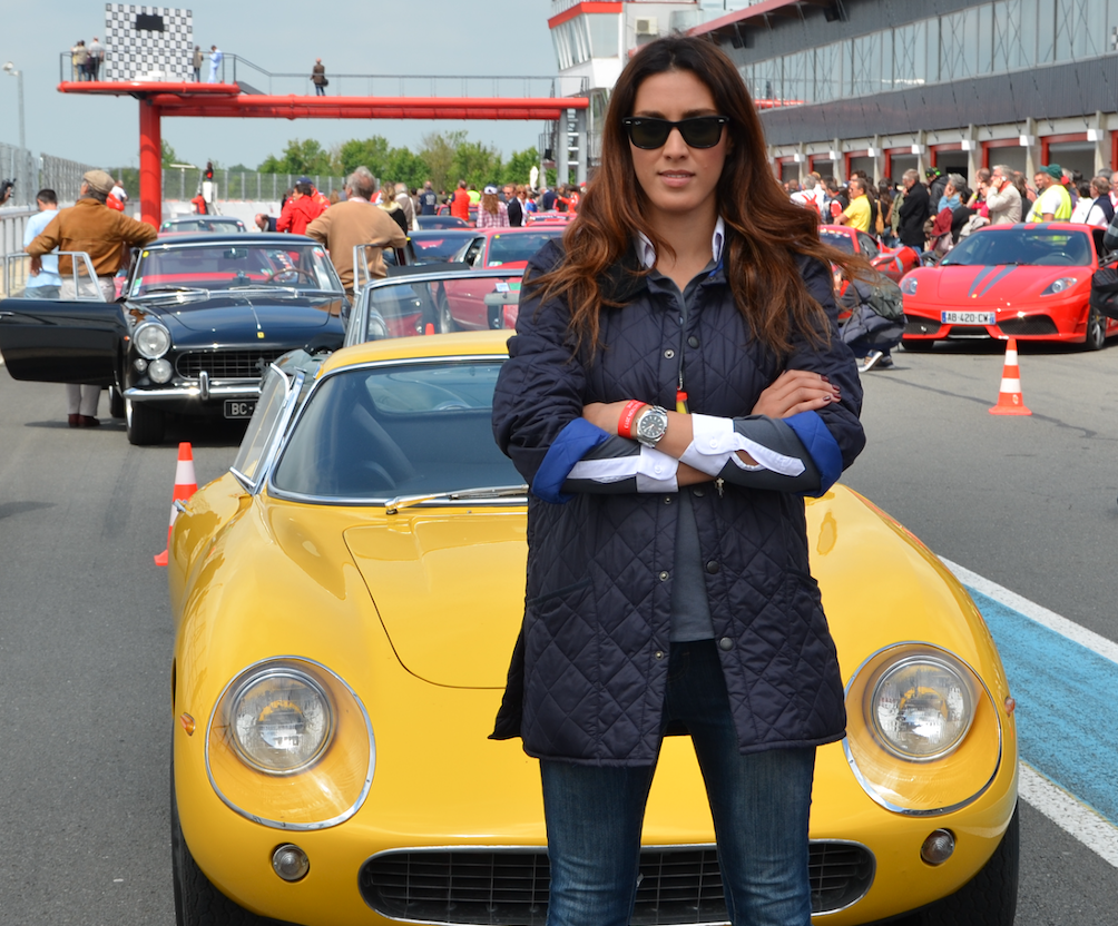 Emma Burslem standing in front of a car